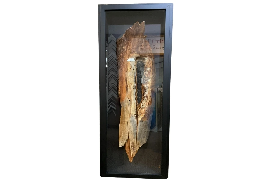 Baseball and cap in a deep shadow box
